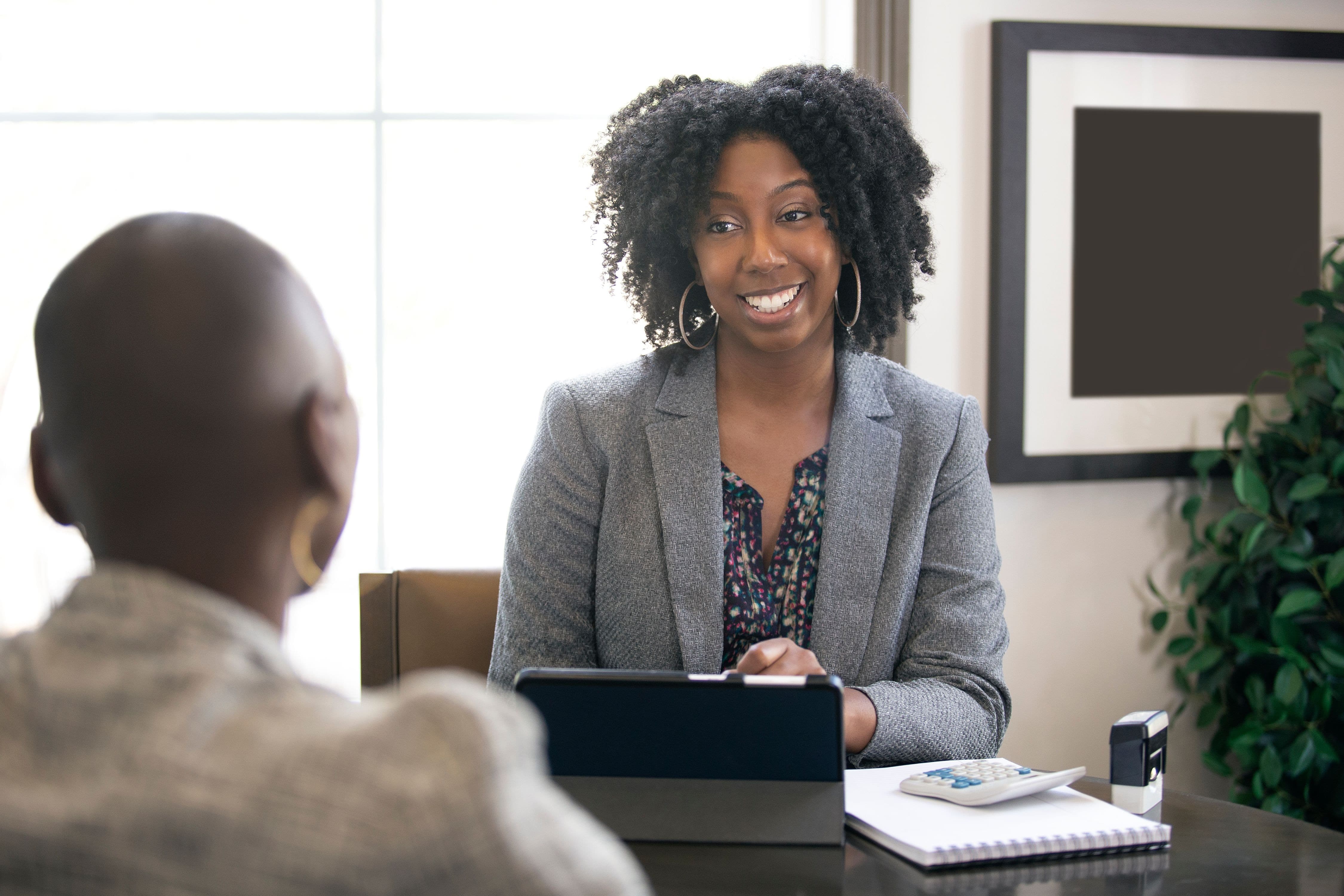 Businesswoman In An Office With A Client